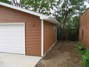 detached garage with concrete foundation and flatwork